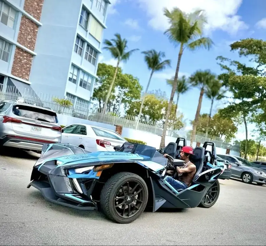 Blue Slingshot Miami — man driving open-air on Miami streets
